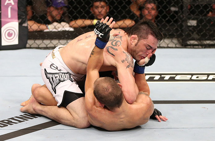 RIO DE JANEIRO, BRAZIL - OCTOBER 13:  (L-R) Rony "Jason" Mariano Bezerra elbows Sam Sicilia during their featherweight fight at UFC 153 inside HSBC Arena on October 13, 2012 in Rio de Janeiro, Brazil.  (Photo by Josh Hedges/Zuffa LLC/Zuffa LLC via Getty Images)