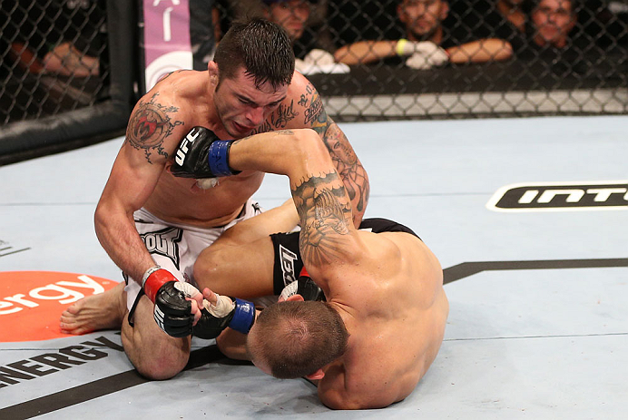 RIO DE JANEIRO, BRAZIL - OCTOBER 13:  (L-R) Rony "Jason" Mariano Bezerra punches Sam Sicilia during their featherweight fight at UFC 153 inside HSBC Arena on October 13, 2012 in Rio de Janeiro, Brazil.  (Photo by Josh Hedges/Zuffa LLC/Zuffa LLC via Getty Images)