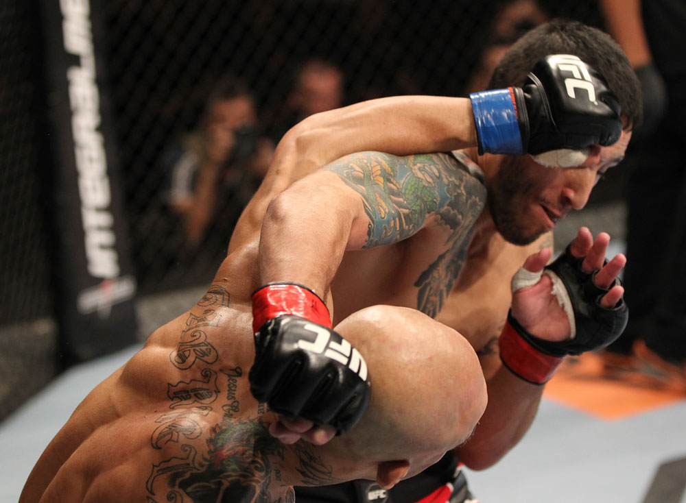 BELO HORIZONTE, BRAZIL - JUNE 23: (L-R) Wagner "Galeto" Campos and Marcos Vinicius "Vina" exchange punches during their UFC 147 featherweight bout at Estadio Jornalista Felipe Drummond on June 23, 2012 in Belo Horizonte, Brazil. (Photo by Josh Hedges/Zuffa LLC/Zuffa LLC via Getty Images)