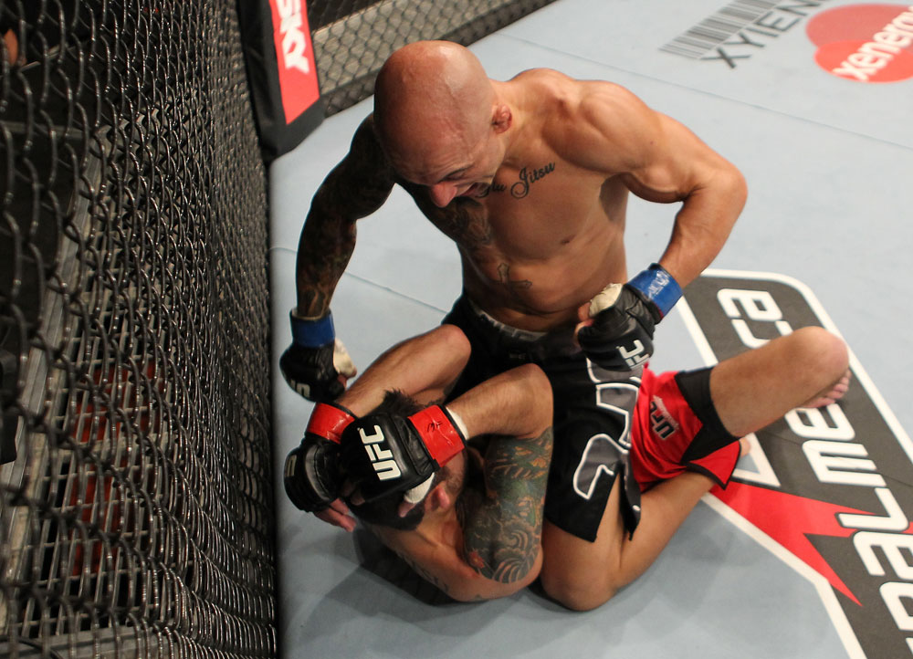 BELO HORIZONTE, BRAZIL - JUNE 23: Wagner "Galeto" Campos (top) punches Marcos Vinicius "Vina" during their UFC 147 featherweight bout at Estadio Jornalista Felipe Drummond on June 23, 2012 in Belo Horizonte, Brazil. (Photo by Josh Hedges/Zuffa LLC/Zuffa LLC via Getty Images)