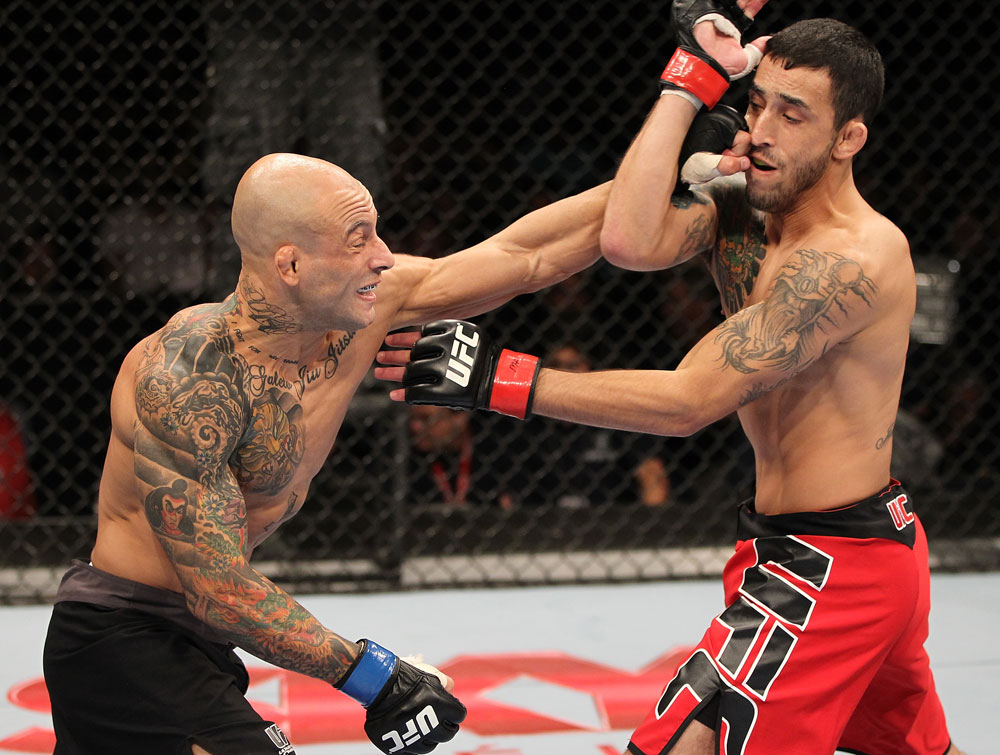 BELO HORIZONTE, BRAZIL - JUNE 23: (L-R) Wagner "Galeto" Campos punches Marcos Vinicius "Vina" during their UFC 147 featherweight bout at Estadio Jornalista Felipe Drummond on June 23, 2012 in Belo Horizonte, Brazil. (Photo by Josh Hedges/Zuffa LLC/Zuffa LLC via Getty Images)