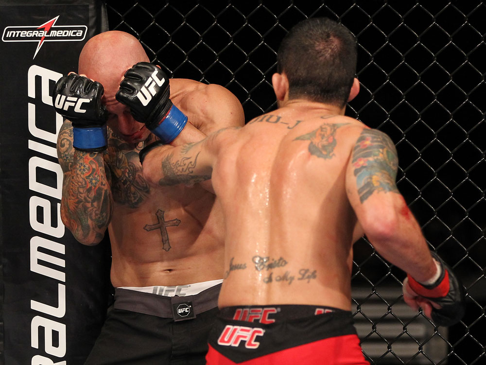 BELO HORIZONTE, BRAZIL - JUNE 23: (R-L) Marcos Vinicius "Vina" punches Wagner "Galeto" Campos during their UFC 147 featherweight bout at Estadio Jornalista Felipe Drummond on June 23, 2012 in Belo Horizonte, Brazil. (Photo by Josh Hedges/Zuffa LLC/Zuffa LLC via Getty Images)