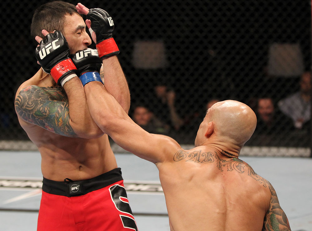 BELO HORIZONTE, BRAZIL - JUNE 23: (R-L) Wagner "Galeto" Campos punches Marcos Vinicius "Vina" during their UFC 147 featherweight bout at Estadio Jornalista Felipe Drummond on June 23, 2012 in Belo Horizonte, Brazil. (Photo by Josh Hedges/Zuffa LLC/Zuffa LLC via Getty Images)
