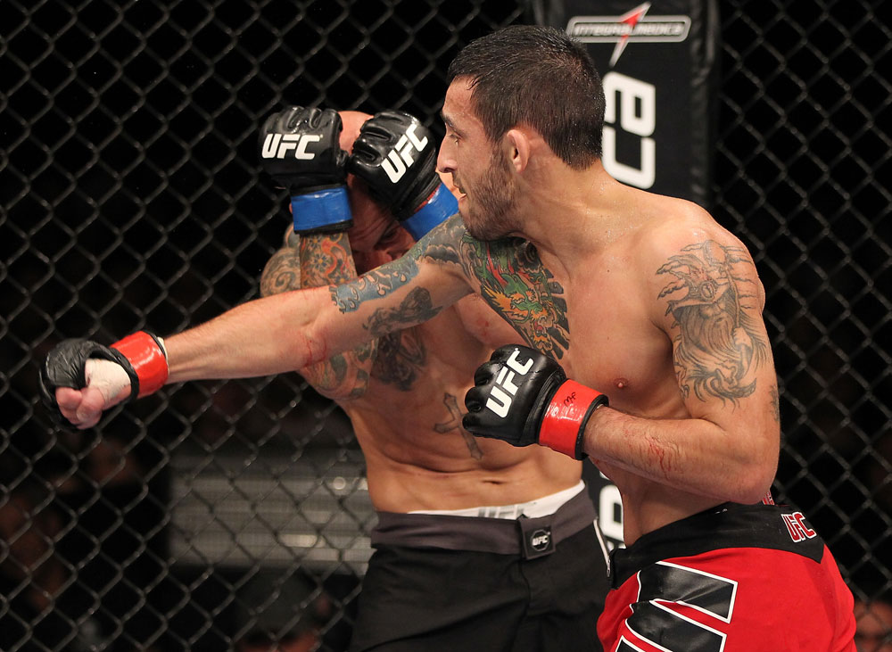 BELO HORIZONTE, BRAZIL - JUNE 23: (R-L) Marcos Vinicius "Vina" punches Wagner "Galeto" Campos during their UFC 147 featherweight bout at Estadio Jornalista Felipe Drummond on June 23, 2012 in Belo Horizonte, Brazil. (Photo by Josh Hedges/Zuffa LLC/Zuffa LLC via Getty Images)