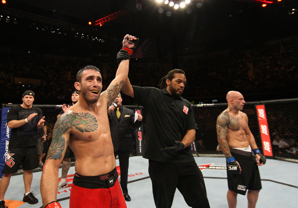 BELO HORIZONTE, BRAZIL - JUNE 23: Marcos Vinicius "Vina" (L) reacts after knocking out Wagner "Galeto" Campos (R) during their UFC 147 featherweight bout at Estadio Jornalista Felipe Drummond on June 23, 2012 in Belo Horizonte, Brazil. (Photo by Josh Hedges/Zuffa LLC/Zuffa LLC via Getty Images)