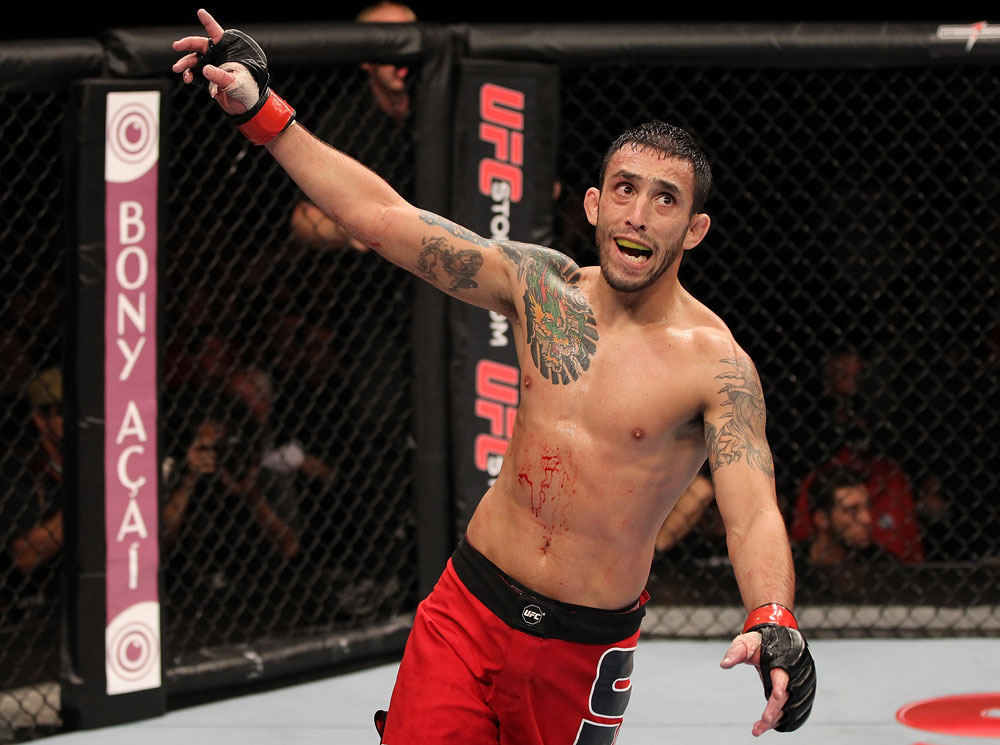 BELO HORIZONTE, BRAZIL - JUNE 23: Marcos Vinicius "Vina" reacts after knocking out Wagner "Galeto" Campos during their UFC 147 featherweight bout at Estadio Jornalista Felipe Drummond on June 23, 2012 in Belo Horizonte, Brazil. (Photo by Josh Hedges/Zuffa LLC/Zuffa LLC via Getty Images)