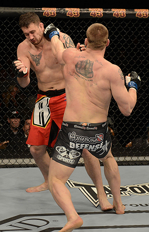 LAS VEGAS, NV - DECEMBER 29:  (R-L) Todd Duffee punches Phil De Fries during their heavyweight fight at UFC 155 on December 29, 2012 at MGM Grand Garden Arena in Las Vegas, Nevada. (Photo by Donald Miralle/Zuffa LLC/Zuffa LLC via Getty Images) *** Local Caption *** Phil De Fries; Todd Duffee