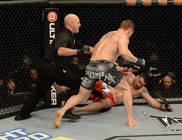LAS VEGAS, NV - DECEMBER 29:  Todd Duffee (gray shorts) attempts to finish Phil De Fries (red shorts) during their heavyweight fight at UFC 155 on December 29, 2012 at MGM Grand Garden Arena in Las Vegas, Nevada. (Photo by Donald Miralle/Zuffa LLC/Zuffa LLC via Getty Images) *** Local Caption *** Phil De Fries; Todd Duffee