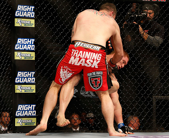 LAS VEGAS, NV - DECEMBER 29:  Phil De Fries (red shorts) punches Todd Duffee during their heavyweight fight at UFC 155 on December 29, 2012 at MGM Grand Garden Arena in Las Vegas, Nevada. (Photo by Josh Hedges/Zuffa LLC/Zuffa LLC via Getty Images) *** Local Caption *** Phil De Fries; Todd Duffee