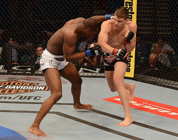 LAS VEGAS, NV - MAY 25:   (R-L) Stephen Thompson punches Nah-Shon Burrell in their welterweight bout during UFC 160 at the MGM Grand Garden Arena on May 25, 2013 in Las Vegas, Nevada.  (Photo by Donald Miralle/Zuffa LLC/Zuffa LLC via Getty Images)  *** Local Caption *** Stephen Thompson; Nah-Shon Burrell