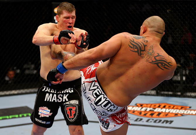 CHICAGO, IL - JANUARY 26:  Shawn Jordan (R) kicks Mike Russow (L) during their Heavyweight Bout part of UFC on FOX at United Center on January 26, 2013 in Chicago, Illinois.  (Photo by Al Bello/Zuffa LLC/Zuffa LLC Via Getty Images)