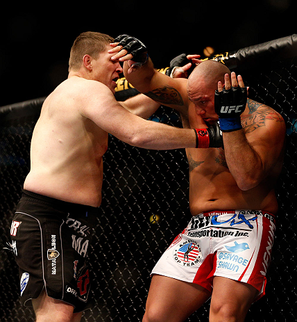 CHICAGO, IL - JANUARY 26:  Shawn Jordan (R) gets punched by Mike Russow (L) during their Heavyweight Bout part of UFC on FOX at United Center on January 26, 2013 in Chicago, Illinois.  (Photo by Josh Hedges/Zuffa LLC/Zuffa LLC Via Getty Images)