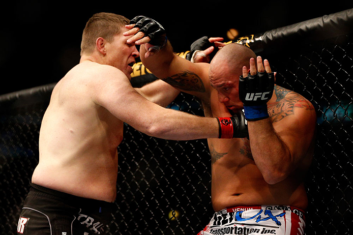 CHICAGO, IL - JANUARY 26:  Shawn Jordan (R) gets punched by Mike Russow (L) during their Heavyweight Bout part of UFC on FOX at United Center on January 26, 2013 in Chicago, Illinois.  (Photo by Josh Hedges/Zuffa LLC/Zuffa LLC Via Getty Images)
