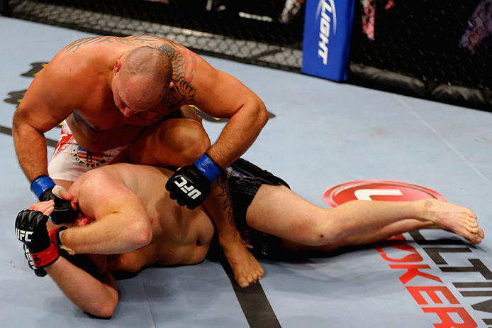 CHICAGO, IL - JANUARY 26:  Shawn Jordan (Top) punches Mike Russow (Bottom) during their Heavyweight Bout part of UFC on FOX at United Center on January 26, 2013 in Chicago, Illinois.  (Photo by Al Bello/Zuffa LLC/Zuffa LLC Via Getty Images)