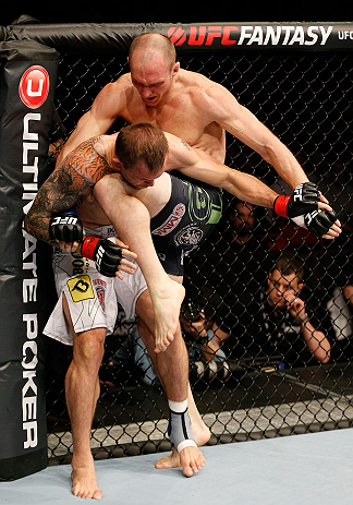 STOCKHOLM, SWEDEN - APRIL 06:  (R-L) Ryan LaFlare knees Benny Alloway in their welterweight fight at the Ericsson Globe Arena on April 6, 2013 in Stockholm, Sweden.  (Photo by Josh Hedges/Zuffa LLC/Zuffa LLC via Getty Images)