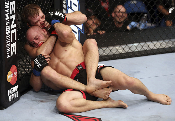CALGARY, CANADA - JULY 21:  Bryan Caraway attempts to choke out Mitch Gagnon during their bantamweight bout at UFC 149 inside the Scotiabank Saddledome on July 21, 2012 in Calgary, Alberta, Canada.  (Photo by Nick Laham/Zuffa LLC/Zuffa LLC via Getty Images)