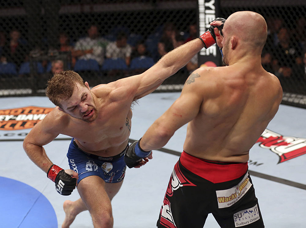 Bryan Caraway lands a punch on Mitch Gagnon during their bantamweight bout at UFC 149 inside the Scotiabank Saddledome on July 21, 2012 in Calgary, Alberta, Canada. (Photo by Nick Laham/Zuffa LLC)