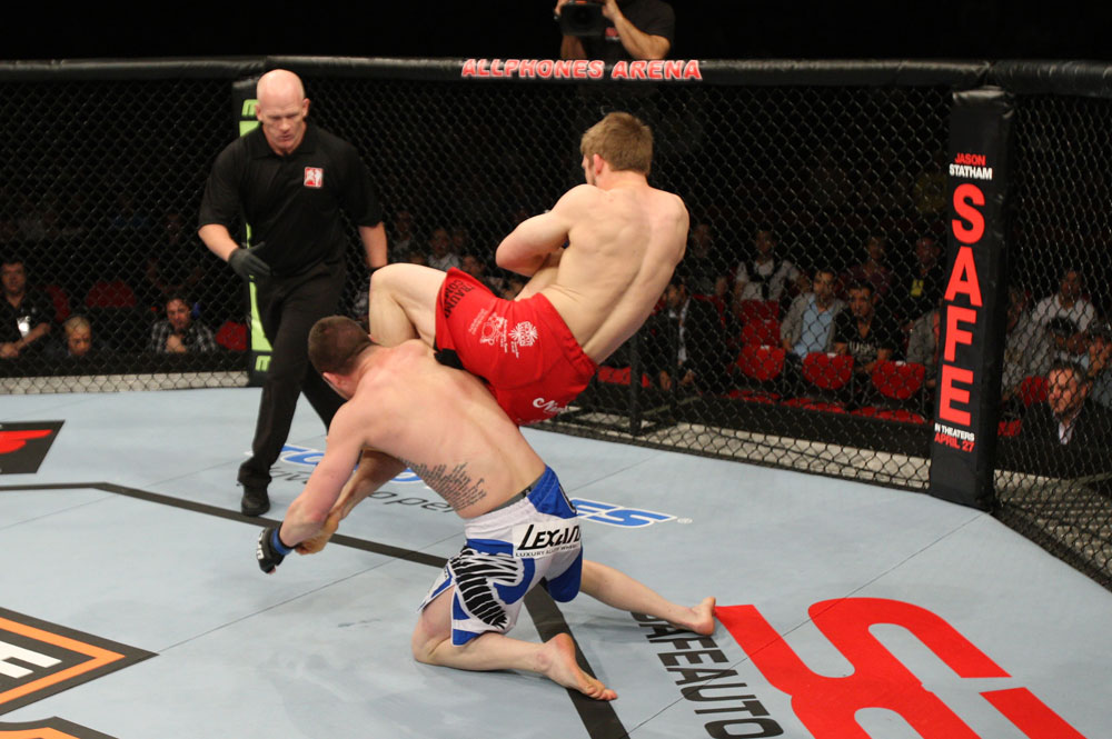 SYDNEY, AUSTRALIA - MARCH 03: (R-L) TJ Waldburger secures an arm bar submission against Jake Hecht in their welterweight bout during the UFC on FX event at Allphones Arena on March 3, 2012 in Sydney, Australia. (Photo by Josh Hedges/Zuffa LLC/Zuffa LLC via Getty Images) *** Local Caption *** TJ Waldburger; Jake Hecht