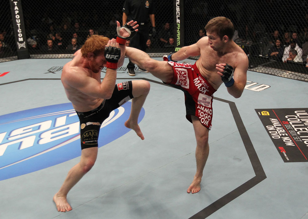 TORONTO, ON - DECEMBER 10:  (R-L) Nik Lentz kicks Mark Bocek during the UFC 140 event at Air Canada Centre on December 10, 2011 in Toronto, Ontario, Canada.  (Photo by Nick Laham/Zuffa LLC/Zuffa LLC via Getty Images)