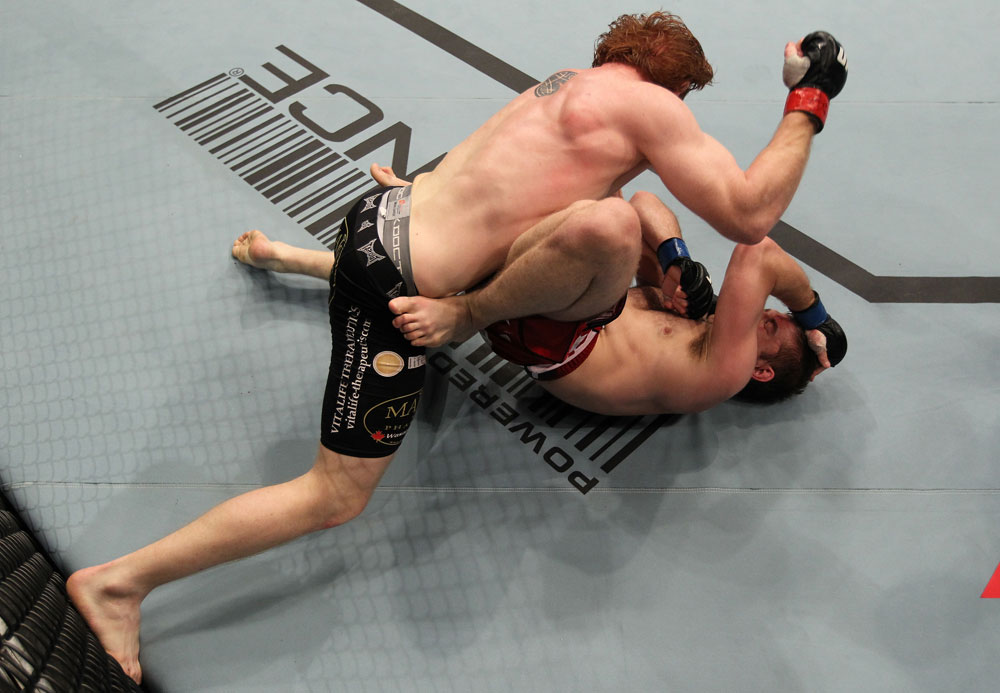 TORONTO, ON - DECEMBER 10:  (L-R) Mark Bocek punches Nik Lentz during the UFC 140 event at Air Canada Centre on December 10, 2011 in Toronto, Ontario, Canada.  (Photo by Nick Laham/Zuffa LLC/Zuffa LLC via Getty Images)