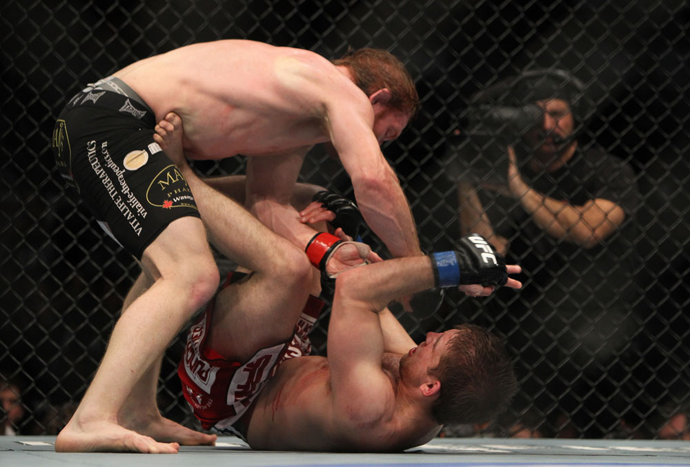 TORONTO, ON - DECEMBER 10:  Mark Bocek punches down at Nik Lentz on the ground during the UFC 140 event at Air Canada Centre on December 10, 2011 in Toronto, Ontario, Canada.  (Photo by Josh Hedges/Zuffa LLC/Zuffa LLC via Getty Images)