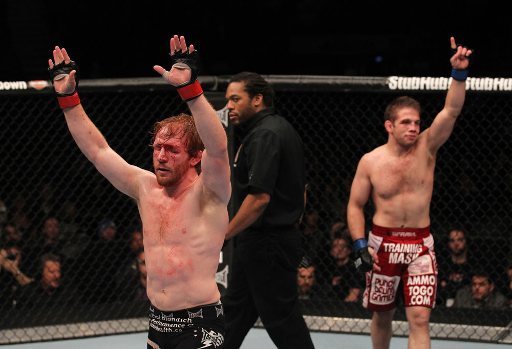 TORONTO, ON - DECEMBER 10:  Mark Bocek (L) and Nik Lentz (R) react after their three-round battle during the UFC 140 event at Air Canada Centre on December 10, 2011 in Toronto, Ontario, Canada.  (Photo by Nick Laham/Zuffa LLC/Zuffa LLC via Getty Images)