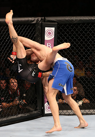 RIO DE JANEIRO, BRAZIL - OCTOBER 13:  (R-L) Demian Maia takes down Rick Story during their welterweight fight at UFC 153 inside HSBC Arena on October 13, 2012 in Rio de Janeiro, Brazil.  (Photo by Josh Hedges/Zuffa LLC/Zuffa LLC via Getty Images)