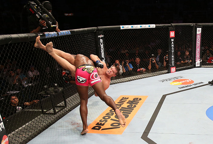 RIO DE JANEIRO, BRAZIL - OCTOBER 13:  (L-R) Phil Davis takes down Wagner Prado during their light heavyweight fight at UFC 153 inside HSBC Arena on October 13, 2012 in Rio de Janeiro, Brazil.  (Photo by Josh Hedges/Zuffa LLC/Zuffa LLC via Getty Images)