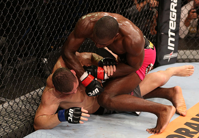 RIO DE JANEIRO, BRAZIL - OCTOBER 13:  (R-L) Phil Davis punches Wagner Prado during their light heavyweight fight at UFC 153 inside HSBC Arena on October 13, 2012 in Rio de Janeiro, Brazil.  (Photo by Josh Hedges/Zuffa LLC/Zuffa LLC via Getty Images)