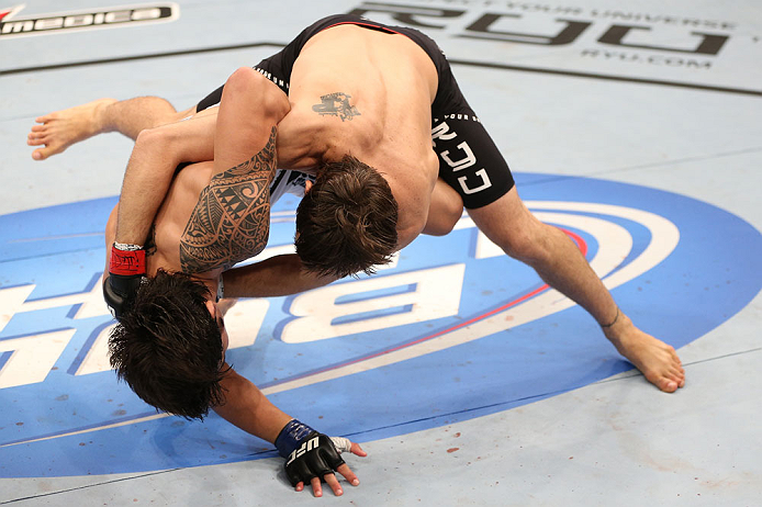 RIO DE JANEIRO, BRAZIL - OCTOBER 13:  (R-L) Jon Fitch takes down Erick Silva during their welterweight fight at UFC 153 inside HSBC Arena on October 13, 2012 in Rio de Janeiro, Brazil.  (Photo by Josh Hedges/Zuffa LLC/Zuffa LLC via Getty Images)