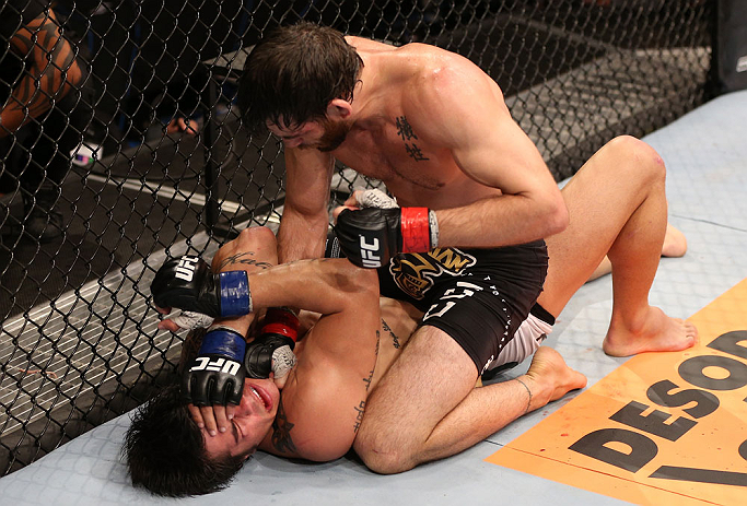 RIO DE JANEIRO, BRAZIL - OCTOBER 13:  (R-L) Jon Fitch punches Erick Silva during their welterweight fight at UFC 153 inside HSBC Arena on October 13, 2012 in Rio de Janeiro, Brazil.  (Photo by Josh Hedges/Zuffa LLC/Zuffa LLC via Getty Images)