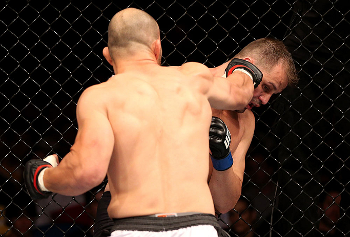 RIO DE JANEIRO, BRAZIL - OCTOBER 13:  (L-R) Glover Teixeira punches Fabio Maldonado during their light heavyweight fight at UFC 153 inside HSBC Arena on October 13, 2012 in Rio de Janeiro, Brazil.  (Photo by Josh Hedges/Zuffa LLC/Zuffa LLC via Getty Images)