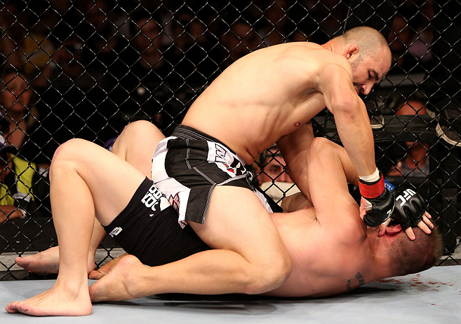 RIO DE JANEIRO, BRAZIL - OCTOBER 13:  (L-R) Glover Teixeira punches Fabio Maldonado during their light heavyweight fight at UFC 153 inside HSBC Arena on October 13, 2012 in Rio de Janeiro, Brazil.  (Photo by Josh Hedges/Zuffa LLC/Zuffa LLC via Getty Images)