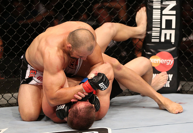RIO DE JANEIRO, BRAZIL - OCTOBER 13:  (L-R) Glover Teixeira elbows Fabio Maldonado during their light heavyweight fight at UFC 153 inside HSBC Arena on October 13, 2012 in Rio de Janeiro, Brazil.  (Photo by Josh Hedges/Zuffa LLC/Zuffa LLC via Getty Images)