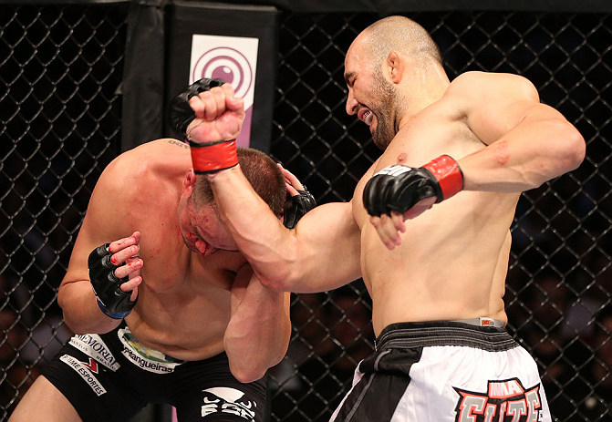 RIO DE JANEIRO, BRAZIL - OCTOBER 13:  (R-L) Glover Teixeira punches Fabio Maldonado during their light heavyweight fight at UFC 153 inside HSBC Arena on October 13, 2012 in Rio de Janeiro, Brazil.  (Photo by Josh Hedges/Zuffa LLC/Zuffa LLC via Getty Images)