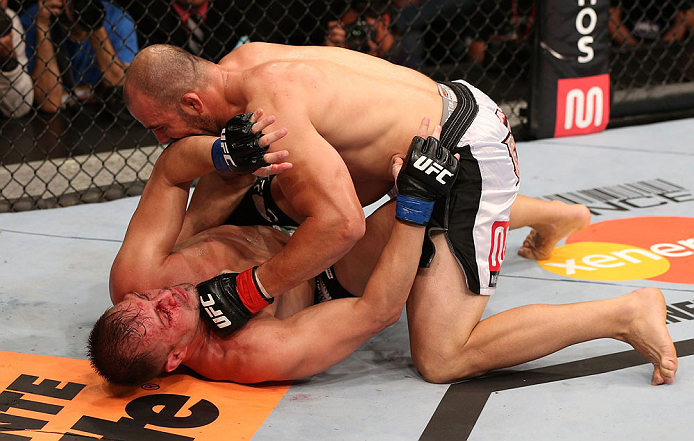 RIO DE JANEIRO, BRAZIL - OCTOBER 13:  (R-L) Glover Teixeira punches Fabio Maldonado during their light heavyweight fight at UFC 153 inside HSBC Arena on October 13, 2012 in Rio de Janeiro, Brazil.  (Photo by Josh Hedges/Zuffa LLC/Zuffa LLC via Getty Images)