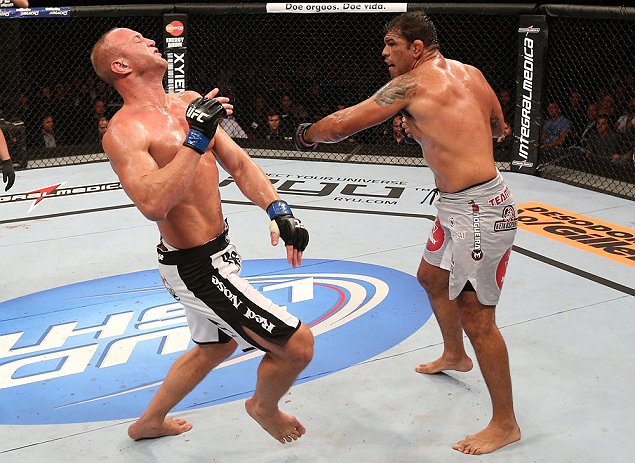 RIO DE JANEIRO, BRAZIL - OCTOBER 13:  (R-L) Antonio Rodrigo "Minotauro" Nogeuira knocks down Dave Herman with a punch during their heavyweight fight at UFC 153 inside HSBC Arena on October 13, 2012 in Rio de Janeiro, Brazil.  (Photo by Josh Hedges/Zuffa LLC/Zuffa LLC via Getty Images)
