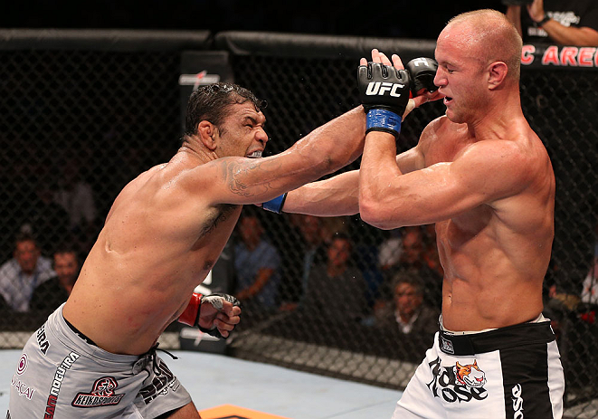 RIO DE JANEIRO, BRAZIL - OCTOBER 13:  (L-R) Antonio Rodrigo "Minotauro" Nogeuira puncehs Dave Herman during their heavyweight fight at UFC 153 inside HSBC Arena on October 13, 2012 in Rio de Janeiro, Brazil.  (Photo by Josh Hedges/Zuffa LLC/Zuffa LLC via Getty Images)