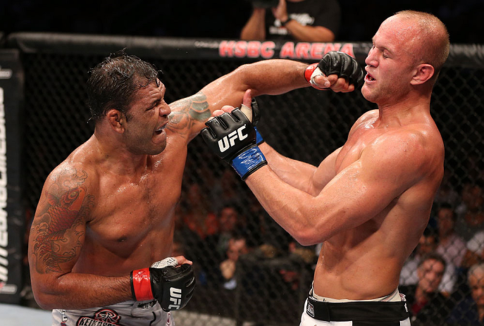 RIO DE JANEIRO, BRAZIL - OCTOBER 13:  (L-R) Antonio Rodrigo "Minotauro" Nogeuira puncehs Dave Herman during their heavyweight fight at UFC 153 inside HSBC Arena on October 13, 2012 in Rio de Janeiro, Brazil.  (Photo by Josh Hedges/Zuffa LLC/Zuffa LLC via Getty Images)