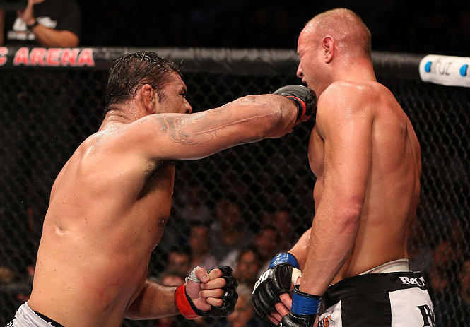 RIO DE JANEIRO, BRAZIL - OCTOBER 13:  (L-R) Antonio Rodrigo "Minotauro" Nogeuira puncehs Dave Herman during their heavyweight fight at UFC 153 inside HSBC Arena on October 13, 2012 in Rio de Janeiro, Brazil.  (Photo by Josh Hedges/Zuffa LLC/Zuffa LLC via Getty Images)