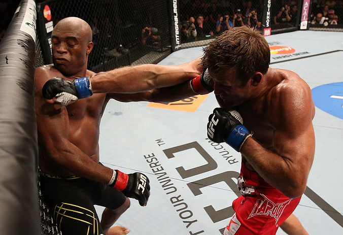 RIO DE JANEIRO, BRAZIL - OCTOBER 13:  (R-L) Stephan Bonnar punches Anderson Silva during their light heavyweight fight at UFC 153 inside HSBC Arena on October 13, 2012 in Rio de Janeiro, Brazil.  (Photo by Josh Hedges/Zuffa LLC/Zuffa LLC via Getty Images)