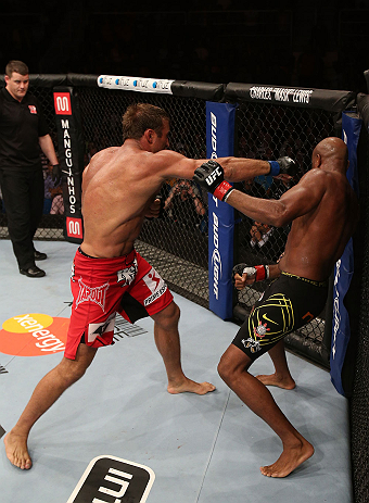 RIO DE JANEIRO, BRAZIL - OCTOBER 13:  (L-R) Stephan Bonnar punches Anderson Silva during their light heavyweight fight at UFC 153 inside HSBC Arena on October 13, 2012 in Rio de Janeiro, Brazil.  (Photo by Josh Hedges/Zuffa LLC/Zuffa LLC via Getty Images)
