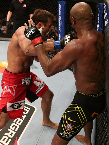 RIO DE JANEIRO, BRAZIL - OCTOBER 13:  (L-R) Stephan Bonnar punches Anderson Silva during their light heavyweight fight at UFC 153 inside HSBC Arena on October 13, 2012 in Rio de Janeiro, Brazil.  (Photo by Josh Hedges/Zuffa LLC/Zuffa LLC via Getty Images)