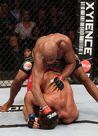RIO DE JANEIRO, BRAZIL - OCTOBER 13:   Anderson Silva (top) punches Stephan Bonnar during their light heavyweight fight at UFC 153 inside HSBC Arena on October 13, 2012 in Rio de Janeiro, Brazil.  (Photo by Josh Hedges/Zuffa LLC/Zuffa LLC via Getty Images)