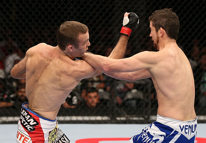 MINNEAPOLIS, MN - OCTOBER 05: (L-R) Jacob Volkmann punches Shane Roller during their lightweight fight at the UFC on FX event at Target Center on October 5, 2012 in Minneapolis, Minnesota. (Photo by Josh Hedges/Zuffa LLC/Zuffa LLC via Getty Images)