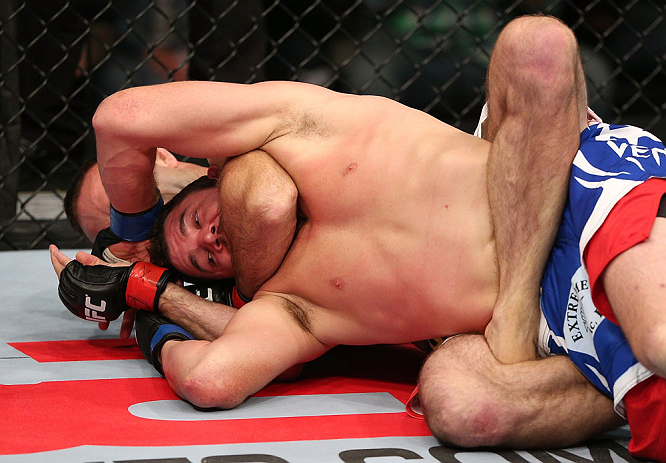 MINNEAPOLIS, MN - OCTOBER 05: (R-L) Jacob Volkmann secures a rear choke submission against Shane Roller during their lightweight fight at the UFC on FX event at Target Center on October 5, 2012 in Minneapolis, Minnesota. (Photo by Josh Hedges/Zuffa LLC/Zuffa LLC via Getty Images)