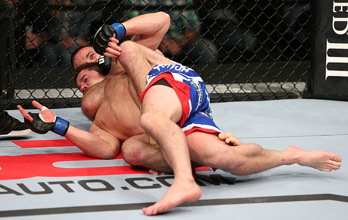 MINNEAPOLIS, MN - OCTOBER 05: (R-L) Jacob Volkmann secures a rear choke submission against Shane Roller during their lightweight fight at the UFC on FX event at Target Center on October 5, 2012 in Minneapolis, Minnesota. (Photo by Josh Hedges/Zuffa LLC/Zuffa LLC via Getty Images)