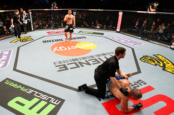 LONDON, ENGLAND - FEBRUARY 16: (L-R) Tom Watson reacts after defeating Stanislav Nedkov in their middleweight fight during the UFC on Fuel TV event on February 16, 2013 at Wembley Arena in London, England. (Photo by Josh Hedges/Zuffa LLC/Zuffa LLC via Getty Images)