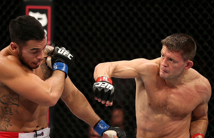 NOTTINGHAM, ENGLAND - SEPTEMBER 29: (R-L) Tom Watson punches Brad Tavares during their middleweight fight at the UFC on Fuel TV event at Capital FM Arena on September 29, 2012 in Nottingham, England. (Photo by Josh Hedges/Zuffa LLC/Zuffa LLC via Getty Images)