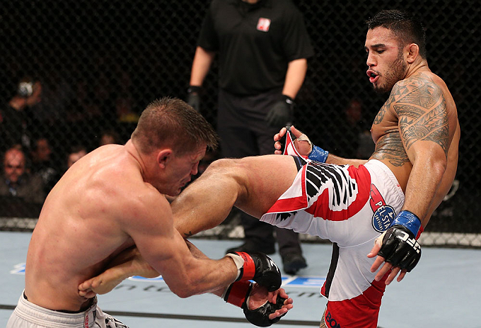 NOTTINGHAM, ENGLAND - SEPTEMBER 29: (R-L) Brad Tavares kicks Tom Watson during their middleweight fight at the UFC on Fuel TV event at Capital FM Arena on September 29, 2012 in Nottingham, England. (Photo by Josh Hedges/Zuffa LLC/Zuffa LLC via Getty Images)